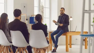 A leader presents in a meeting