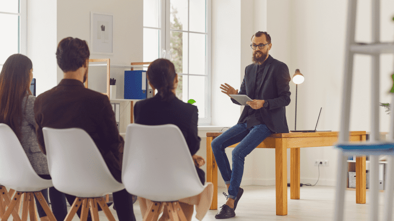 A leader presents in a meeting