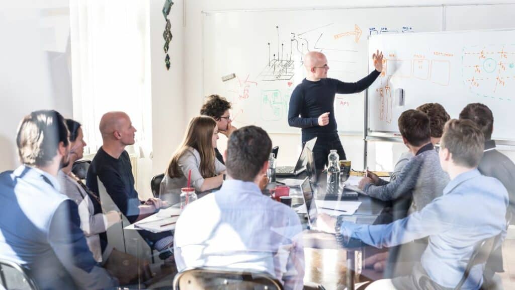 Emerging leaders learning to lead through X5 Management's leadership program.