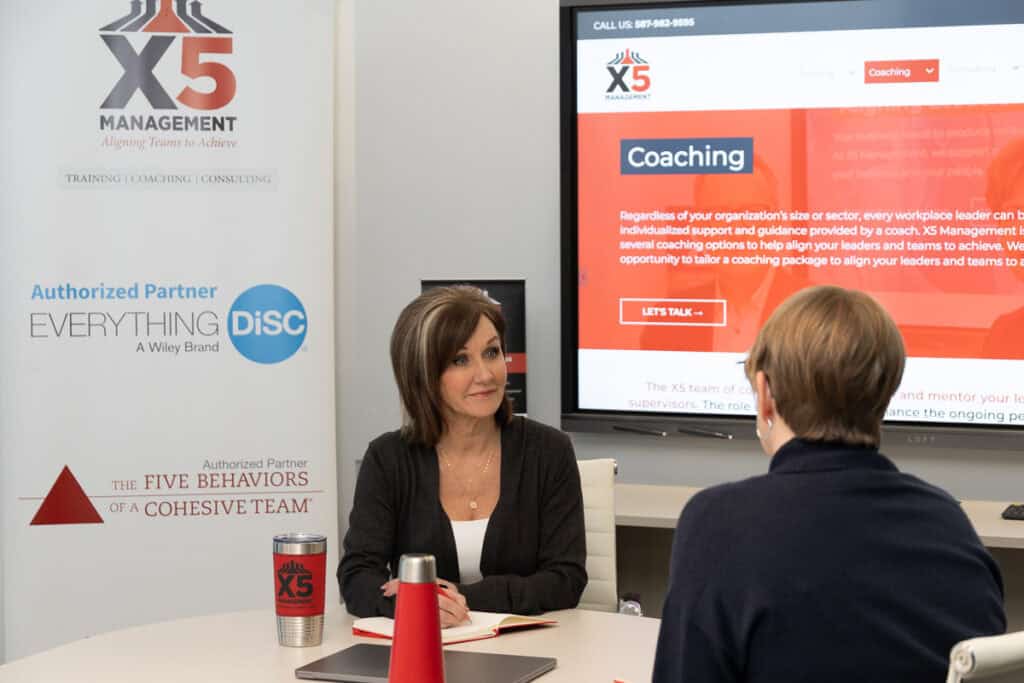 X5 Management team providing executive coaching.