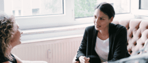 Office scene with two women taking part in an executive coaching session.