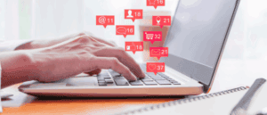 User at a laptop who is receiving messages in different forms