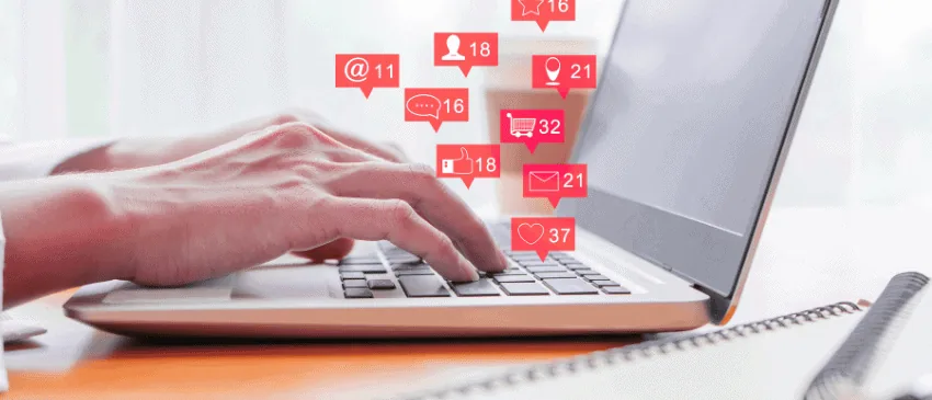 User at a laptop who is receiving messages in different forms to show the types of communication